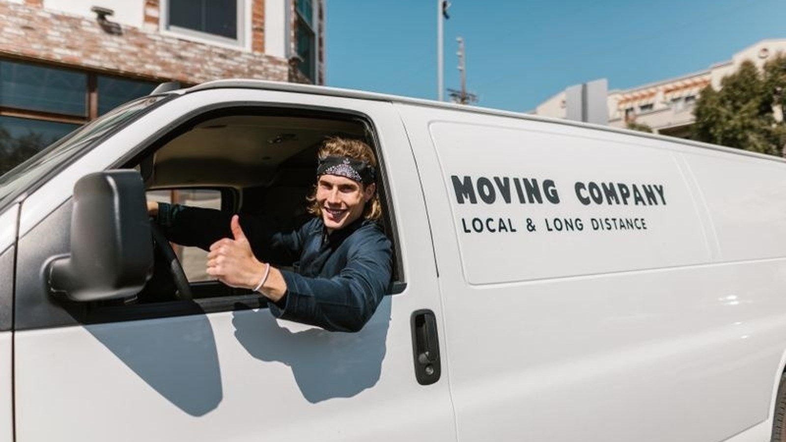 The Moving Firm moving truck and crew